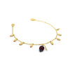 Gold charm bracelet with little flower buds and a cocoa pod, with red zirconia stones