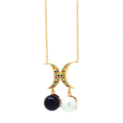 Crescent moon pendant necklace with multicoloured zirconia stones and a black and white pearl charm, in gold and rose gold vermeil